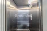 Aufzug - Moderne Penthousewohnung mit großzügiger, umlaufender Dachterrasse und Tiefgaragen-Stellplatz
