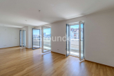 Wohnzimmer - Moderne Penthousewohnung mit großzügiger, umlaufender Dachterrasse und Tiefgaragen-Stellplatz