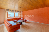 EG Wohnzimmer - Großzügiges Einfamilienhaus mit Einliegerwohnung, Garten und Terrasse in Roßtal