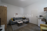 Wohnzimmer (1) - Im Rückgebäude: vermietete und sanierte 2-Zimmer-Wohnung mit Stellplatz