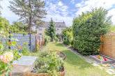 Garten - Gepflegtes Reihenmittelhaus mit großem Garten und Garage in Nürnberg