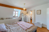OG3 rechts Schlafzimmer - Gepflegtes Mehrfamilienhaus mit stabiler Rendite und ca. 1.260m² vermietbarer Fläche in Traunstein
