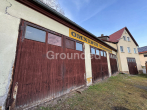 Ansicht Hallentore - Großzügiges Anwesen mit Wohnhaus, diversen Fahrzeughallen und Gartengrundstück in Pfarrweisach